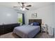Relaxing bedroom features a bed, natural light from window, and rustic decorative touches at 3411 Massey Pond Trl, Raleigh, NC 27616