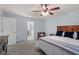 Bedroom boasts a ceiling fan and a view to the en-suite bathroom at 3411 Massey Pond Trl, Raleigh, NC 27616