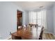 Traditional dining room with a large wood table, seating for eight, and natural light at 3411 Massey Pond Trl, Raleigh, NC 27616