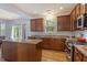 Open kitchen with granite countertops, stainless steel appliances, and a center island at 3411 Massey Pond Trl, Raleigh, NC 27616