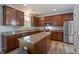 Spacious kitchen with granite counters, stainless steel appliances, and an island for extra workspace at 3411 Massey Pond Trl, Raleigh, NC 27616