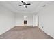 Large bedroom with neutral carpet, a window, a ceiling fan and attached bathroom at 3513 Diamond Springs Dr, Raleigh, NC 27610
