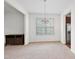 Open dining room featuring a chandelier, window, and stainless steel refrigerator at 3513 Diamond Springs Dr, Raleigh, NC 27610