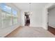 Open dining room featuring a chandelier with views of the kitchen at 3513 Diamond Springs Dr, Raleigh, NC 27610
