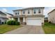 Well-maintained two-story home featuring an attached garage, concrete driveway, and manicured front lawn at 3513 Diamond Springs Dr, Raleigh, NC 27610