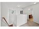 Hallway with staircase and a view to a full bathroom at 3513 Diamond Springs Dr, Raleigh, NC 27610