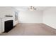 Spacious living room with neutral carpet, fireplace, and a ceiling fan at 3513 Diamond Springs Dr, Raleigh, NC 27610