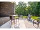 An outdoor patio features a grill, dining set, and plenty of room to entertain guests at 3704 Hesters Store Rd, Hurdle Mills, NC 27541