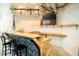 The basement features a custom bar with black barstools at 3704 Hesters Store Rd, Hurdle Mills, NC 27541