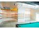 Finished basement features a pool table and large wall-mounted shelving at 3704 Hesters Store Rd, Hurdle Mills, NC 27541