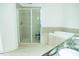 Bright bathroom featuring a glass enclosed shower and a soaking tub at 3704 Hesters Store Rd, Hurdle Mills, NC 27541