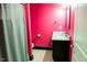 Bright pink bathroom featuring a shower and granite vanity at 3704 Hesters Store Rd, Hurdle Mills, NC 27541