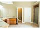 A bathroom featuring dual vanities, a separate toilet area, and a tile shower at 3704 Hesters Store Rd, Hurdle Mills, NC 27541
