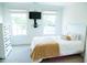 This bedroom features a large window and a wall mounted TV at 3704 Hesters Store Rd, Hurdle Mills, NC 27541