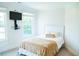This bedroom features a large window and a wall mounted TV at 3704 Hesters Store Rd, Hurdle Mills, NC 27541