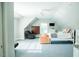Bright bedroom featuring a ceiling fan, a black leather chair, and a white dresser at 3704 Hesters Store Rd, Hurdle Mills, NC 27541