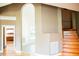 Elegant entryway with an arched doorway leading to stairs at 3704 Hesters Store Rd, Hurdle Mills, NC 27541