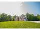 Sprawling brick home with manicured lawn and inviting curb appeal, perfect for Gathering living at 3704 Hesters Store Rd, Hurdle Mills, NC 27541