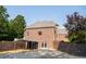 Rear exterior featuring brick, a carport, french doors, and a small outdoor area at 3704 Hesters Store Rd, Hurdle Mills, NC 27541