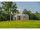 Beautiful brick home featuring a stone facade, multiple windows, and a meticulously maintained lawn at 3704 Hesters Store Rd, Hurdle Mills, NC 27541