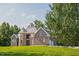 Gorgeous brick home with a stone facade, manicured lawn, and a private setting at 3704 Hesters Store Rd, Hurdle Mills, NC 27541