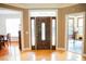 Elegant foyer with hardwood floors, a decorative front door, and views into multiple rooms at 3704 Hesters Store Rd, Hurdle Mills, NC 27541