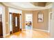 Welcoming foyer featuring hardwood floors, a stylish front door, and views into other rooms at 3704 Hesters Store Rd, Hurdle Mills, NC 27541
