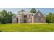 Stunning brick home with meticulously manicured lawn and stone accents at 3704 Hesters Store Rd, Hurdle Mills, NC 27541
