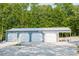Spacious four-door garage, providing ample parking and storage space for vehicles and equipment at 3704 Hesters Store Rd, Hurdle Mills, NC 27541