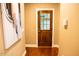 Hallway featuring wooden floors and doors leading to the garage and other parts of the home at 3704 Hesters Store Rd, Hurdle Mills, NC 27541