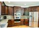 Modern kitchen with stainless steel appliances and beautiful cabinetry at 3704 Hesters Store Rd, Hurdle Mills, NC 27541