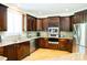 Well-equipped kitchen with granite countertops and stainless steel appliances at 3704 Hesters Store Rd, Hurdle Mills, NC 27541
