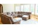 Spacious living room with a large sectional couch and bright windows at 3704 Hesters Store Rd, Hurdle Mills, NC 27541