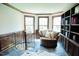 This office features custom built in bookcases and exterior windows at 3704 Hesters Store Rd, Hurdle Mills, NC 27541