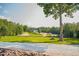 Extensive country property featuring various outbuildings, lush greenery, and gravel driveways at 3704 Hesters Store Rd, Hurdle Mills, NC 27541
