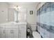 Bathroom featuring a white vanity, a toilet, a mirror, and a patterned shower curtain at 398 Carolina Ave, Raleigh, NC 27606