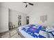 Bedroom with a bed, a chair, two windows, and a doorway to an ensuite bathroom at 398 Carolina Ave, Raleigh, NC 27606