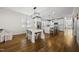 Open dining area connecting to a modern kitchen featuring an island with seating and stainless steel appliances at 398 Carolina Ave, Raleigh, NC 27606
