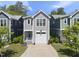 Charming two-story home with a well-manicured lawn, a driveway, and an attached single-car garage at 398 Carolina Ave, Raleigh, NC 27606