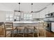 Bright kitchen featuring white cabinets, stainless steel appliances, quartz counters, and a large island at 398 Carolina Ave, Raleigh, NC 27606