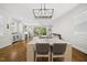 Open-concept living and dining area with hardwood floors, fireplace, and sliding door to the patio; airy and inviting space at 398 Carolina Ave, Raleigh, NC 27606