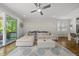 Living room with plush sectional, decorative rug, and sliding glass doors; great flow for indoor-outdoor living at 398 Carolina Ave, Raleigh, NC 27606