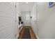 Well-organized mudroom with custom shelving, coat hooks, and a patterned rug; functional and tidy entry space at 398 Carolina Ave, Raleigh, NC 27606