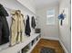 Bright mudroom featuring built-in storage, coat hooks, and hardwood floors at 398 Carolina Ave, Raleigh, NC 27606