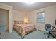 Comfortable bedroom featuring a plush bed, soft carpet, natural light, and a cozy chair at 4005 King Charles Rd, Durham, NC 27707
