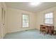 Bedroom featuring carpet and a large window that provides ample natural light at 4005 King Charles Rd, Durham, NC 27707