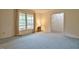 Bright bedroom with large window at 4005 King Charles Rd, Durham, NC 27707