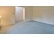Bright bedroom with blue carpet and an open doorway at 4005 King Charles Rd, Durham, NC 27707