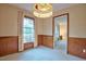 Well-lit dining room features a chandelier and a large window at 4005 King Charles Rd, Durham, NC 27707