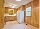 Kitchen featuring wooden cabinets and a large window at 4005 King Charles Rd, Durham, NC 27707